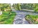 Long winding street with roadside landscaping and perimeter fencing at 6372 English Creek Dr, Lakeland, FL 33811