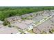 Aerial view of the townhome community surrounded by lush greenery at 6506 Sedgeford Dr, Lakeland, FL 33811