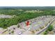 Aerial view of townhome in a lush community near a tranquil pond at 6506 Sedgeford Dr, Lakeland, FL 33811