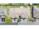 Aerial view of townhome showcasing the roof, landscaping, and front parking area at 6506 Sedgeford Dr, Lakeland, FL 33811