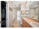 Primary bathroom with double sinks, soaking tub, shower, and large walk-in closet at 6506 Sedgeford Dr, Lakeland, FL 33811