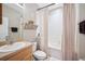 Bathroom with a shower/tub combination, towel rack, vanity and single sink at 6506 Sedgeford Dr, Lakeland, FL 33811