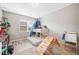 Bright bedroom featuring a bunk bed, slide, and playful decor at 6506 Sedgeford Dr, Lakeland, FL 33811
