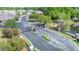 Elevated view of neighborhood entrance featuring iron gates, stone pillars, and landscaping at 6506 Sedgeford Dr, Lakeland, FL 33811