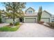 Charming townhome featuring a brick driveway, two-car garage, and well-maintained landscaping at 6506 Sedgeford Dr, Lakeland, FL 33811