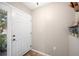 Bright foyer with neutral walls, tile flooring, and a view of the lush exterior at 6506 Sedgeford Dr, Lakeland, FL 33811