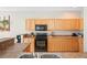 Clean kitchen with wooden cabinets, modern appliances and plenty of counter space for meal preparation at 6506 Sedgeford Dr, Lakeland, FL 33811