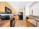 Efficient kitchen featuring wooden cabinets and modern appliances, creating a practical cooking space at 6506 Sedgeford Dr, Lakeland, FL 33811