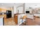 Open kitchen featuring a breakfast bar overlooking the living room, perfect for entertaining guests at 6506 Sedgeford Dr, Lakeland, FL 33811