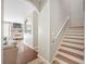 View of staircase with wooden steps, and open sightlines to the living room and decor at 6506 Sedgeford Dr, Lakeland, FL 33811