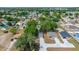 Aerial view of the home and neighborhood with mature trees and landscaping at 6625 Thornhill Rd, Winter Haven, FL 33880