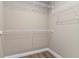 Walk-in closet featuring vinyl plank flooring, base trim and wire shelving at 6625 Thornhill Rd, Winter Haven, FL 33880