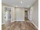 Hallway with neutral paint, recessed lighting, and luxury vinyl plank flooring at 6625 Thornhill Rd, Winter Haven, FL 33880