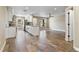 Open concept kitchen with white cabinetry, stainless steel appliances and island at 6625 Thornhill Rd, Winter Haven, FL 33880