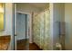 Bathroom with a shower and granite countertop vanity and hardwood floors at 6626 Royal Forest Dr, Lakeland, FL 33811
