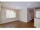 Bright living room with hardwood floors and a pendant light fixture with large window and lots of natural light at 6626 Royal Forest Dr, Lakeland, FL 33811