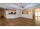 Expansive living area with breakfast bar, seamlessly connecting to the kitchen and dining area at 6626 Royal Forest Dr, Lakeland, FL 33811