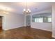 Open living area with beautiful floors, archways, and views into other living spaces at 6626 Royal Forest Dr, Lakeland, FL 33811