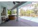 Screened-in pool with hot tub and outdoor furniture at 6626 Royal Forest Dr, Lakeland, FL 33811