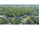 Aerial view of a residential neighborhood featuring tree-lined streets and single-Gathering homes at 6911 Wildberry Ln, Lakeland, FL 33813