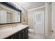 Bathroom features a vanity with black cabinets and a shower/tub combo at 6911 Wildberry Ln, Lakeland, FL 33813