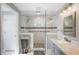 Elegant bathroom featuring walk-in shower and a double vanity at 6911 Wildberry Ln, Lakeland, FL 33813