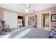 Bedroom with a rocking chair, double closet, and ensuite bathroom at 6911 Wildberry Ln, Lakeland, FL 33813