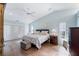 Light-filled bedroom with vaulted ceilings and wood-look flooring at 6911 Wildberry Ln, Lakeland, FL 33813