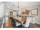 Elegant dining room featuring hardwood floors, large table, and sophisticated decor at 6911 Wildberry Ln, Lakeland, FL 33813