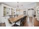 Stylish dining room showcases hardwood floors, built in shelves, and lots of natural light at 6911 Wildberry Ln, Lakeland, FL 33813