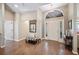 Inviting home entryway with a hardwood floor, high ceilings, and decorative features at 6911 Wildberry Ln, Lakeland, FL 33813