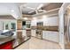 Kitchen featuring white cabinetry, granite countertops, and stainless steel appliances at 6911 Wildberry Ln, Lakeland, FL 33813