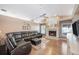 Comfortable living room features a fireplace, and an oversized sectional sofa atop an area rug at 6911 Wildberry Ln, Lakeland, FL 33813
