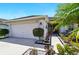 Inviting home exterior with a well-manicured lawn and a two-car garage at 7139 Cedarcrest Blvd, Lakeland, FL 33810
