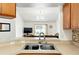 Kitchen sink that overlooks the living room at 7139 Cedarcrest Blvd, Lakeland, FL 33810