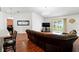 Open-concept living area with hardwood floors and plenty of natural light at 7139 Cedarcrest Blvd, Lakeland, FL 33810