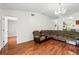 Open concept living room with hardwood floors and modern lighting at 7139 Cedarcrest Blvd, Lakeland, FL 33810