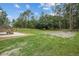 Large backyard featuring a concrete patio and a well-maintained lawn at 7202 Glen Meadow Dr, Lakeland, FL 33810
