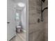 Updated bathroom with tiled shower and chrome shower head at 7202 Glen Meadow Dr, Lakeland, FL 33810