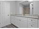 Bathroom vanity with granite countertop, white cabinets, and chrome fixtures at 7202 Glen Meadow Dr, Lakeland, FL 33810