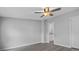Bedroom featuring a ceiling fan, light gray walls, and luxury vinyl plank flooring at 7202 Glen Meadow Dr, Lakeland, FL 33810