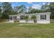 Attractive single-story home with a well-kept lawn and mature landscaping at 7202 Glen Meadow Dr, Lakeland, FL 33810