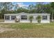 Charming single-story home with mature trees and well-maintained lawn at 7202 Glen Meadow Dr, Lakeland, FL 33810