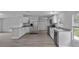 Well-lit kitchen with stainless steel appliances and a large island at 7202 Glen Meadow Dr, Lakeland, FL 33810