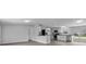 Open concept kitchen with stainless steel appliances and gray countertops at 7202 Glen Meadow Dr, Lakeland, FL 33810