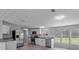 Open-concept kitchen featuring stainless steel appliances and granite countertops at 7202 Glen Meadow Dr, Lakeland, FL 33810