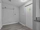 Convenient laundry room features shelving and a charming windowed door at 7202 Glen Meadow Dr, Lakeland, FL 33810