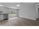 Open floor plan with ample natural light and hardwood flooring throughout at 7202 Glen Meadow Dr, Lakeland, FL 33810