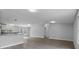 Bright open floor plan with hardwood flooring, kitchen and living room combo at 7202 Glen Meadow Dr, Lakeland, FL 33810