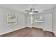 Bright bedroom with ample closet space, wood-look floors, and windows offering plenty of natural light at 747 E Bella Vista St, Lakeland, FL 33805